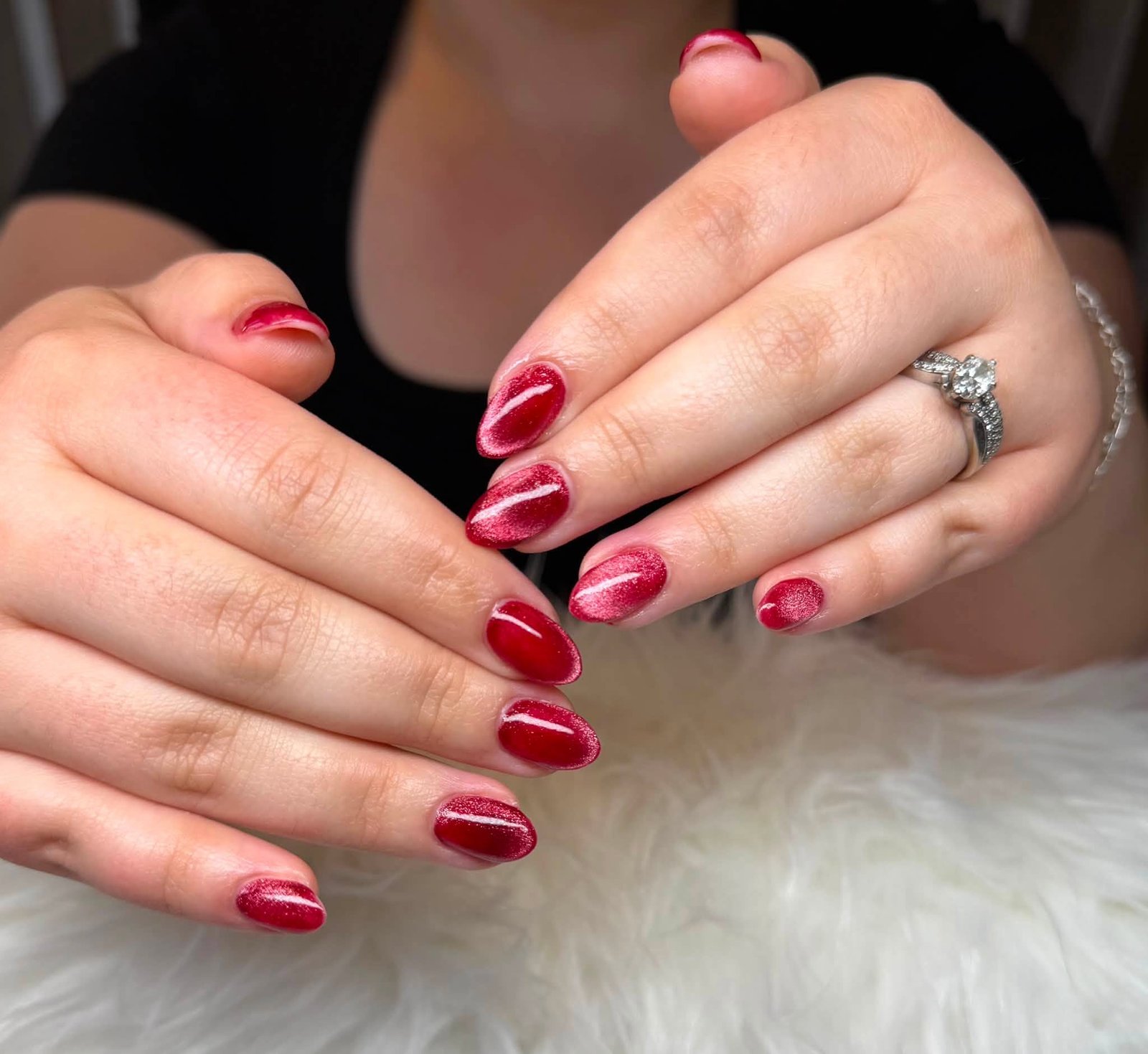 Pale pink manicure with silver tips and studs
