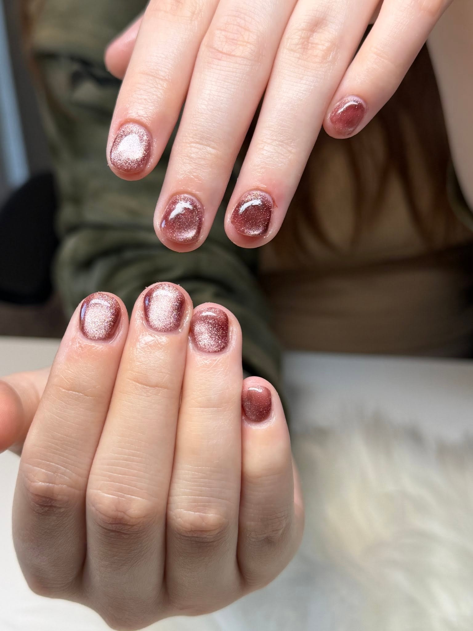 Shimmering rose gold glitter manicure