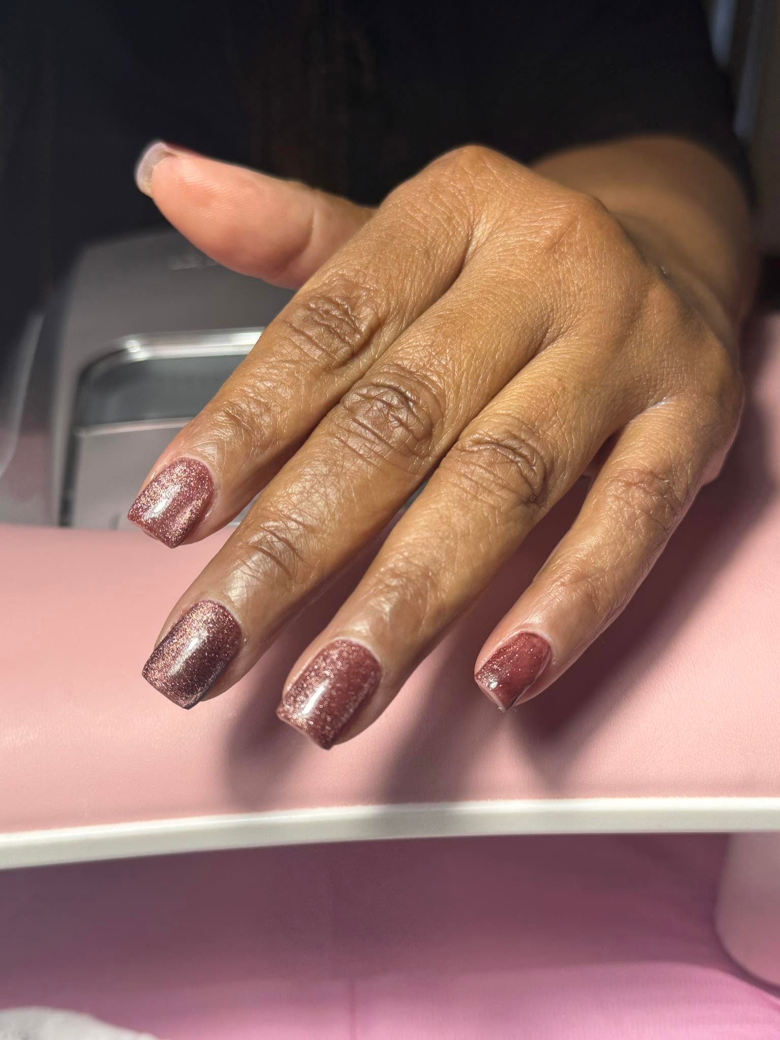 Rose gold glitter gel manicure with sparkling metallic finish