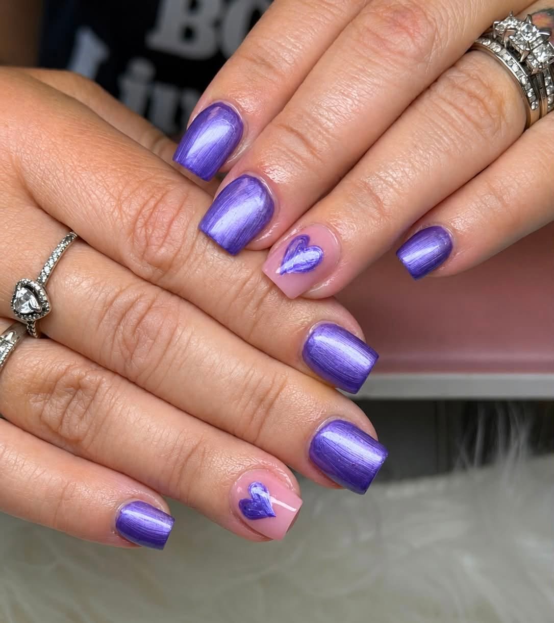 Purple pearlescent manicure with heart accent