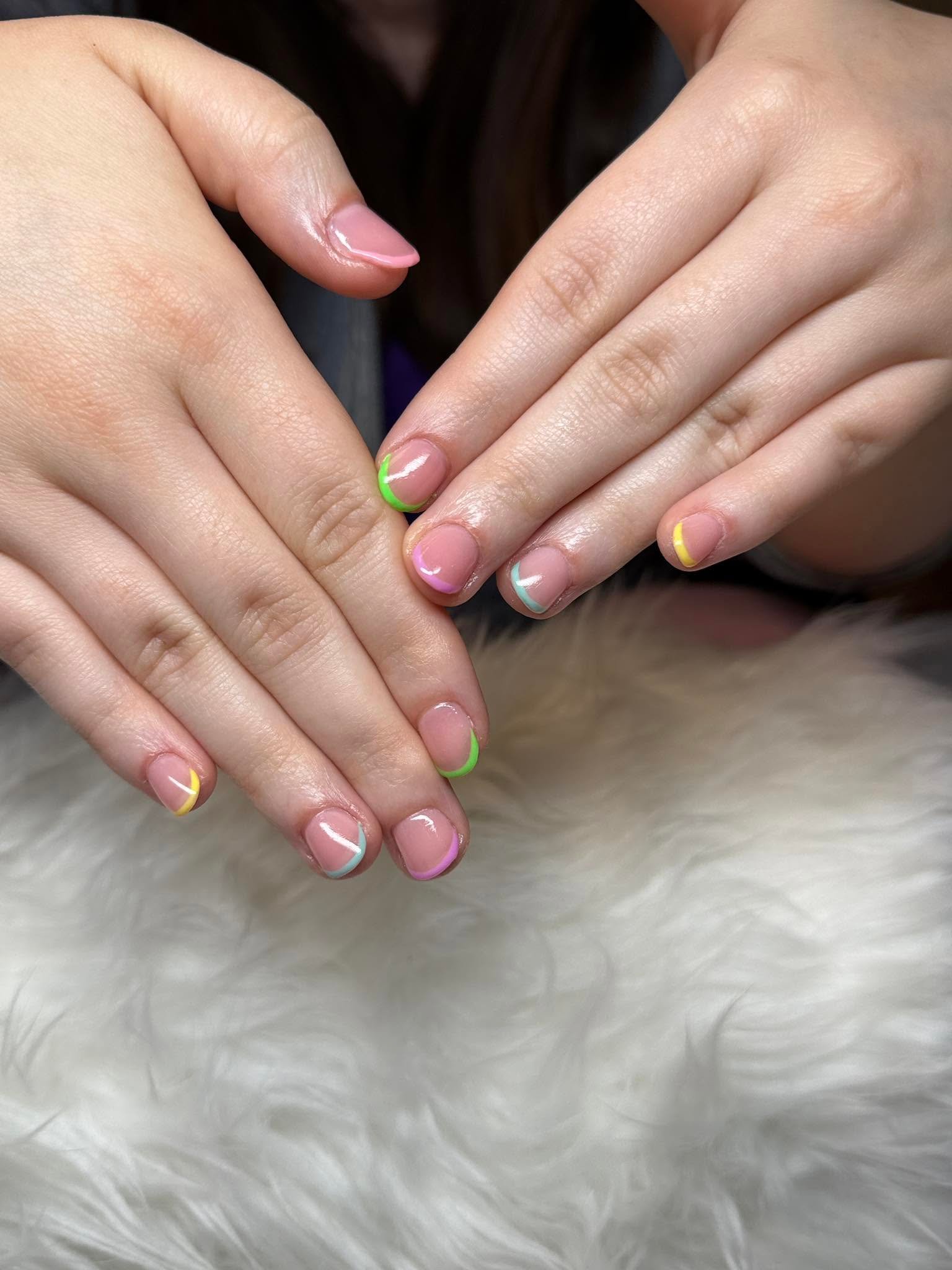 Nude nails with pastel multicolor French tips
