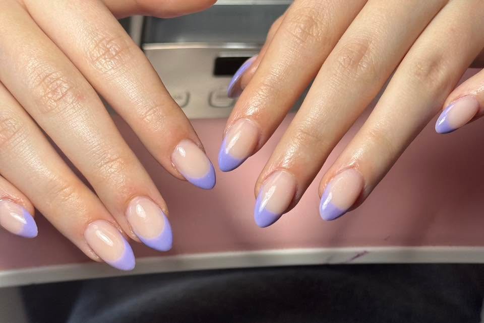 Glossy lavender French tip manicure on almond nails