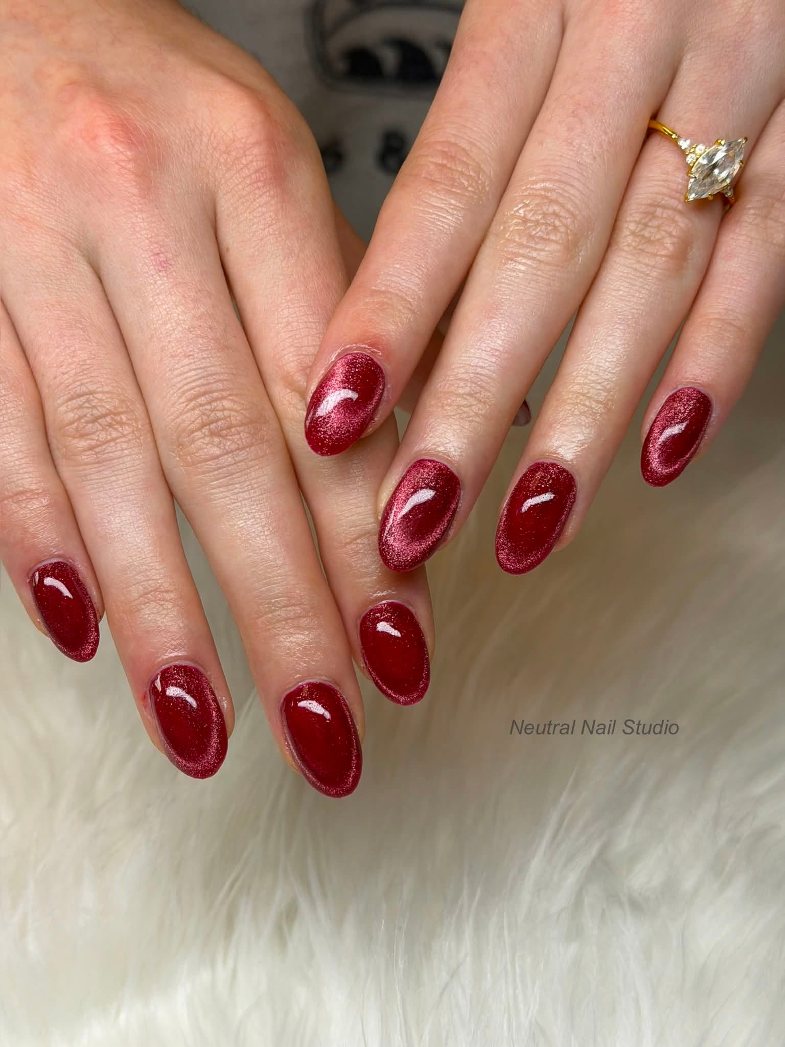 Deep red shimmer gel manicure