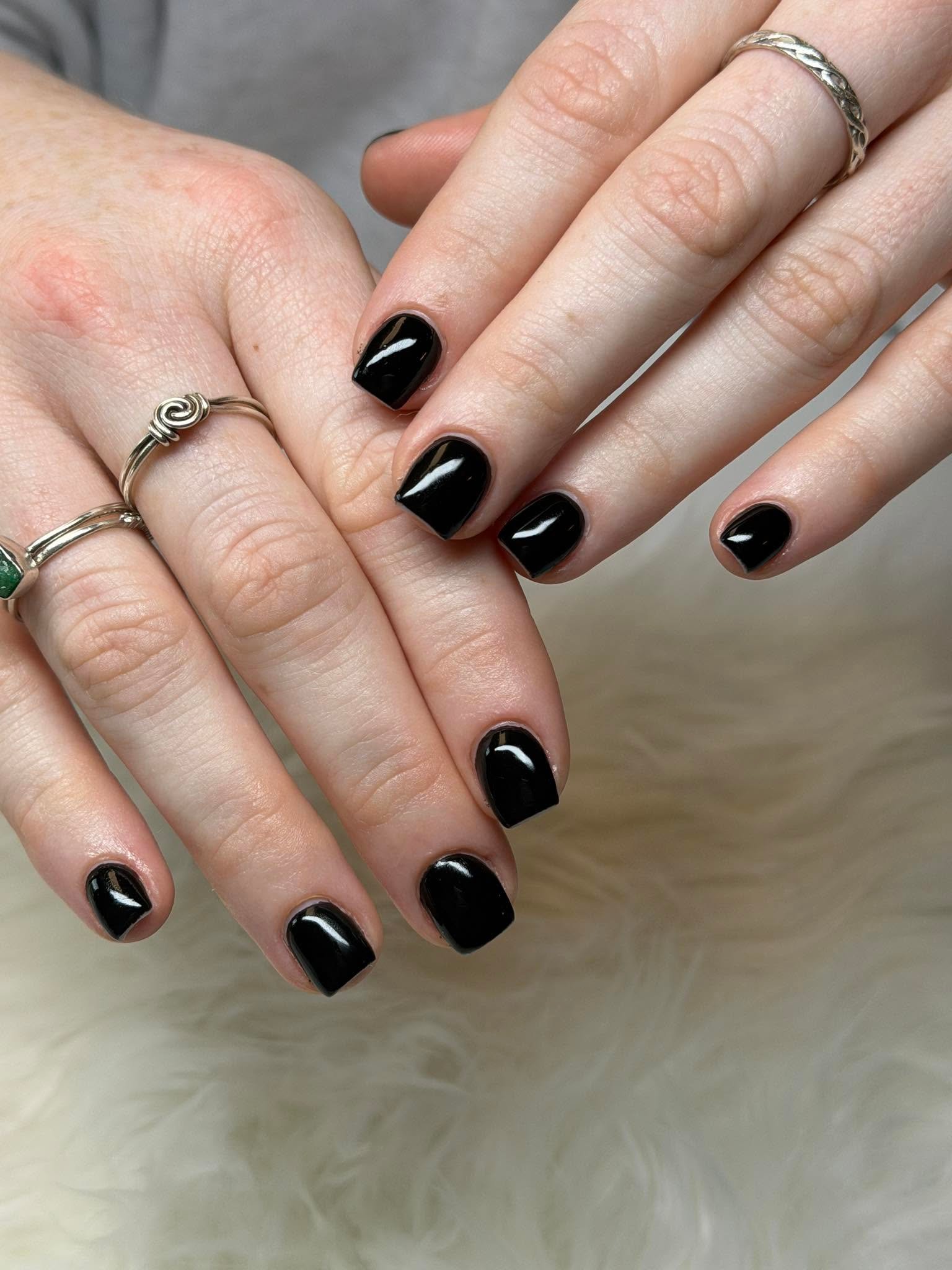 Sleek solid black gel manicure
