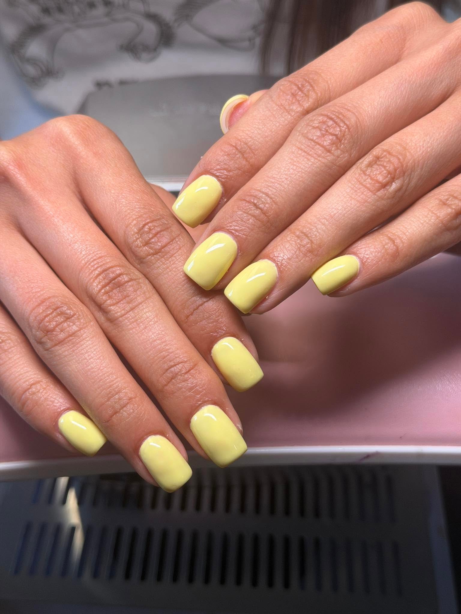 Bright yellow solid gel manicure