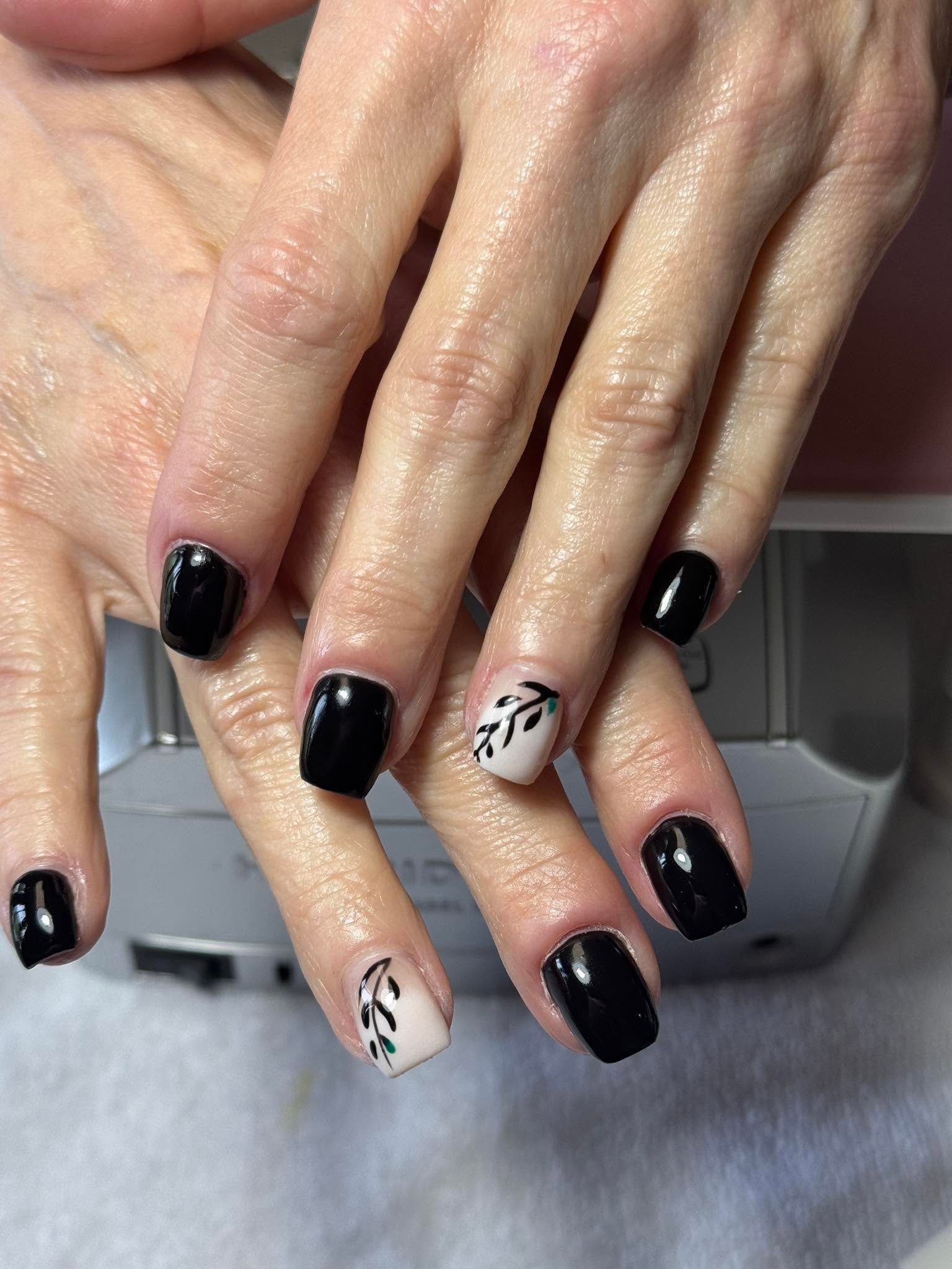 Glossy black gel manicure with one branch-art accent nail