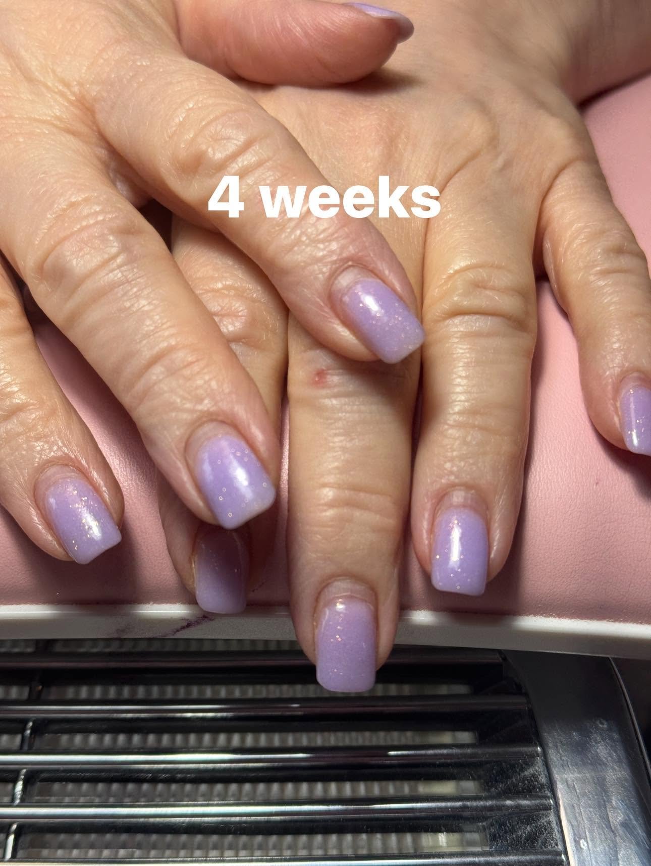 Soft lilac gel manicure with fine glitter shimmer