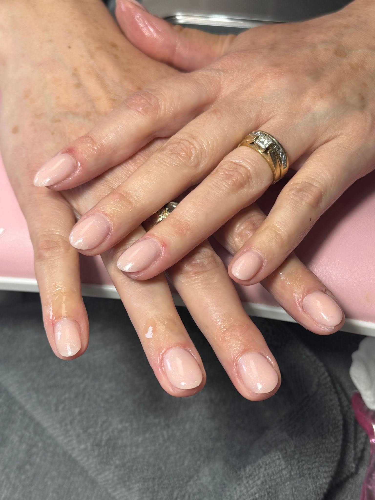 Sheer natural pink gel manicure on short round nails