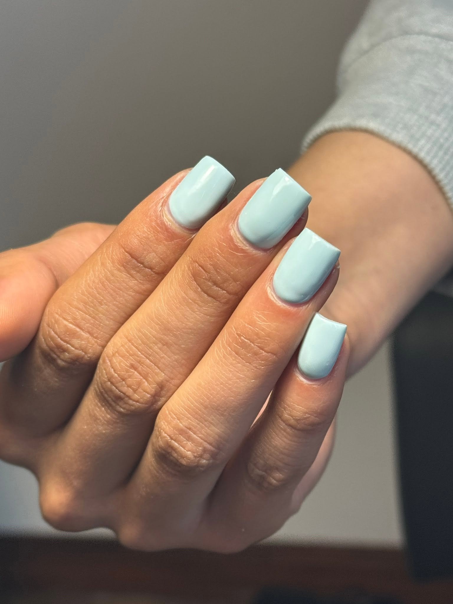Pale mint blue solid gel manicure on squoval nails