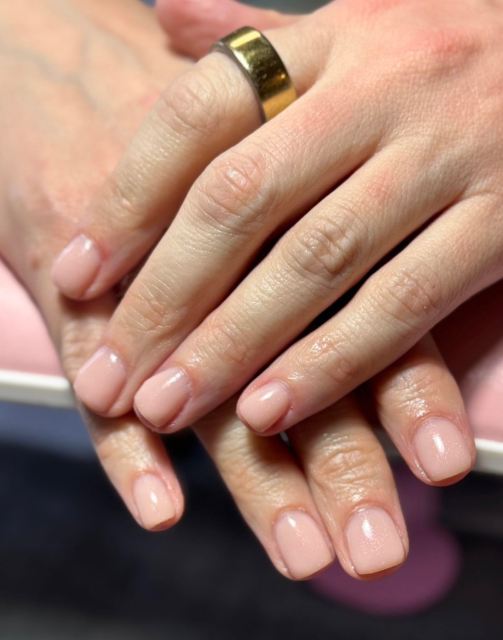 Pale nude pink solid gel manicure with glossy shine