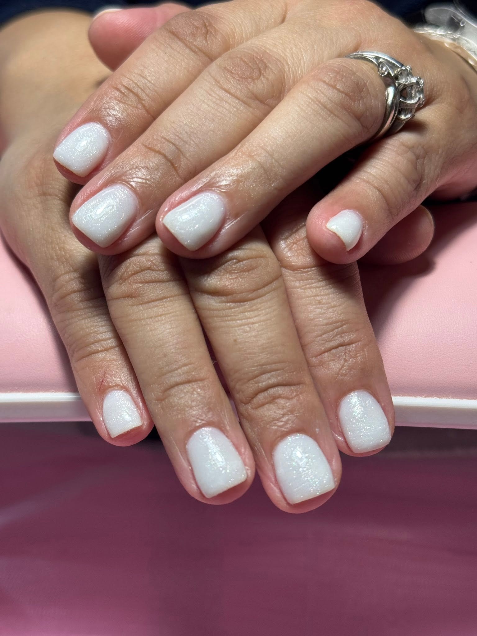 Bright white solid gel manicure with soft shimmer