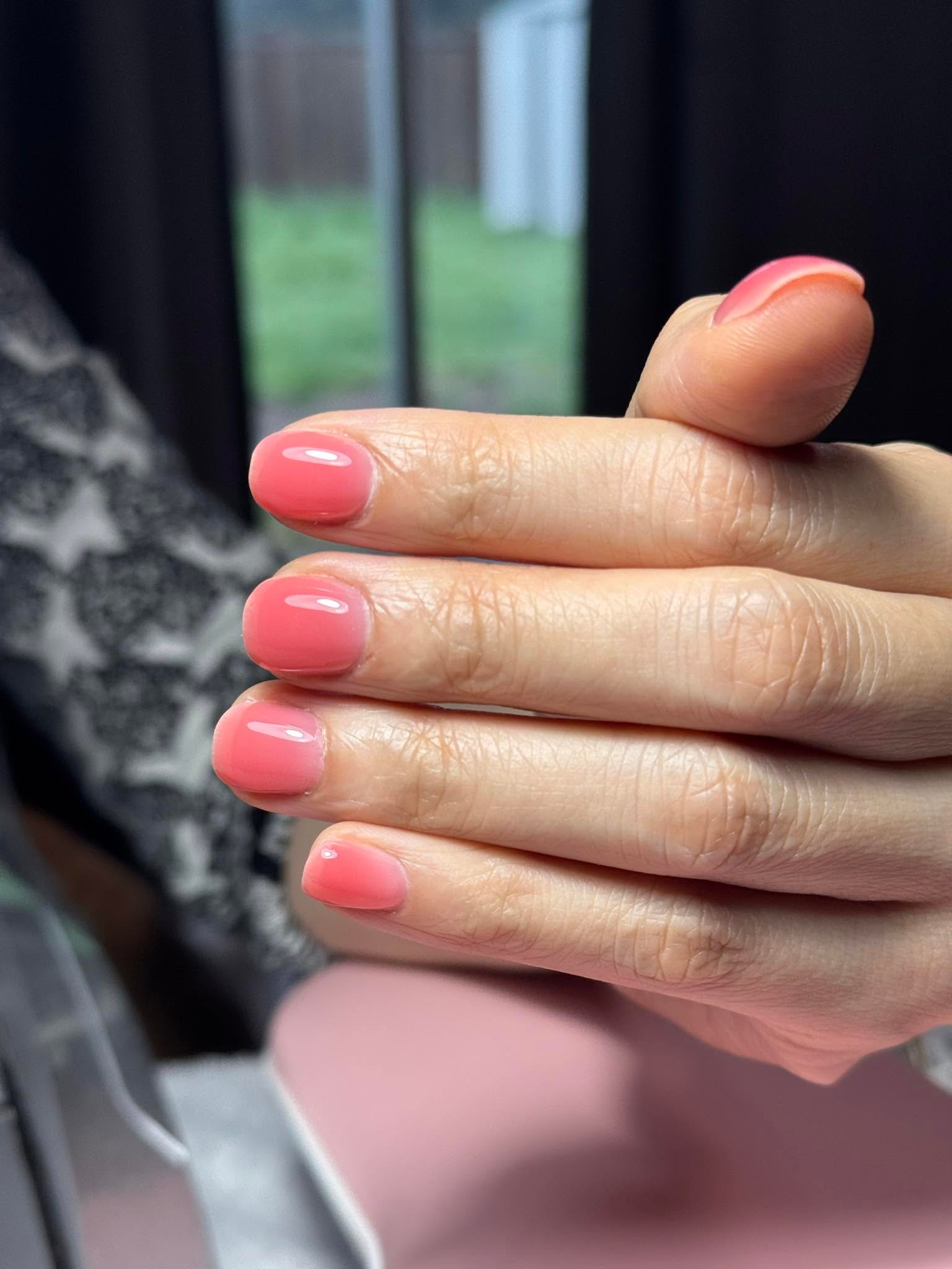 Soft coral pink solid gel manicure with glossy finish