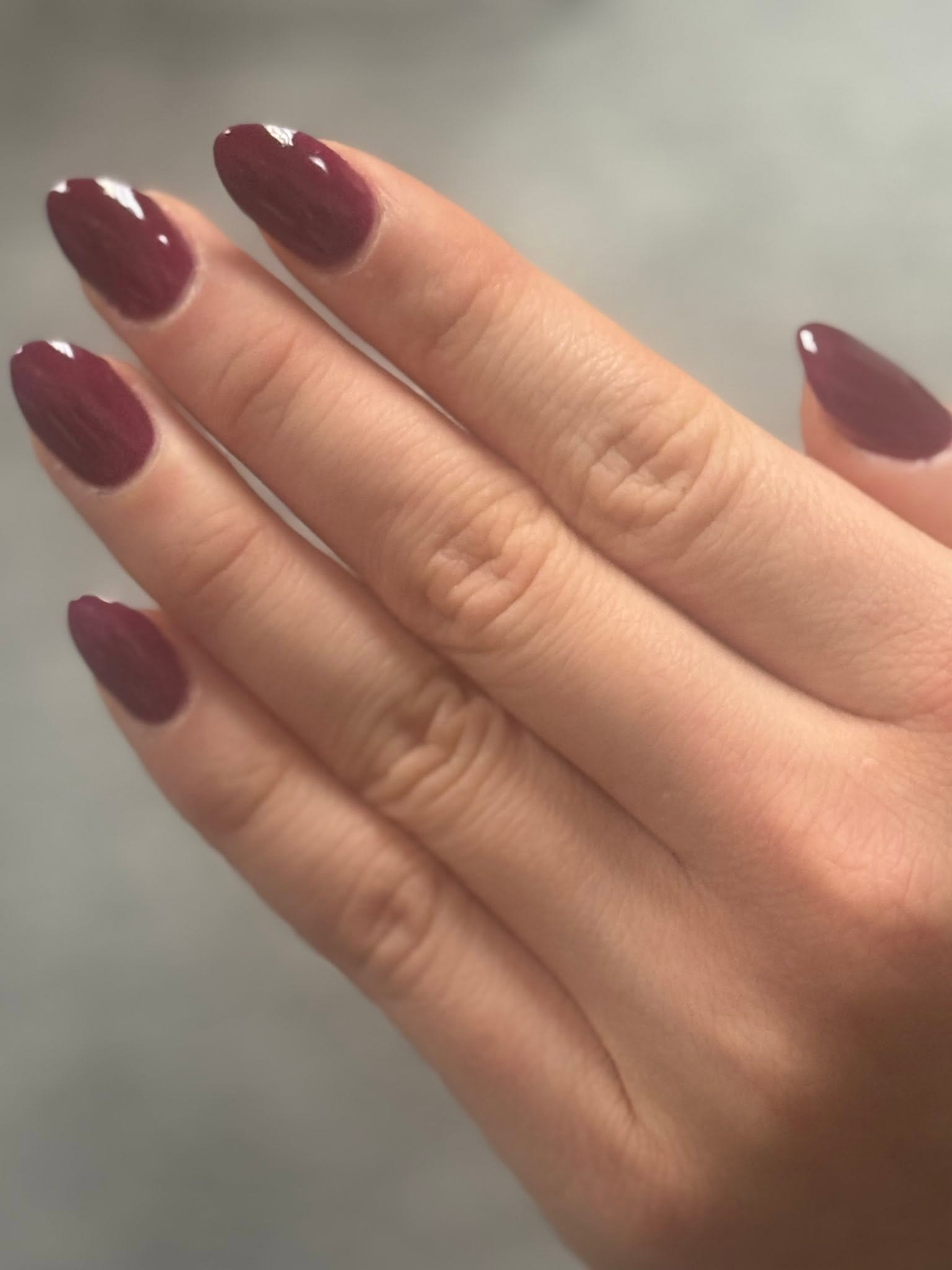 Deep burgundy glossy almond nails