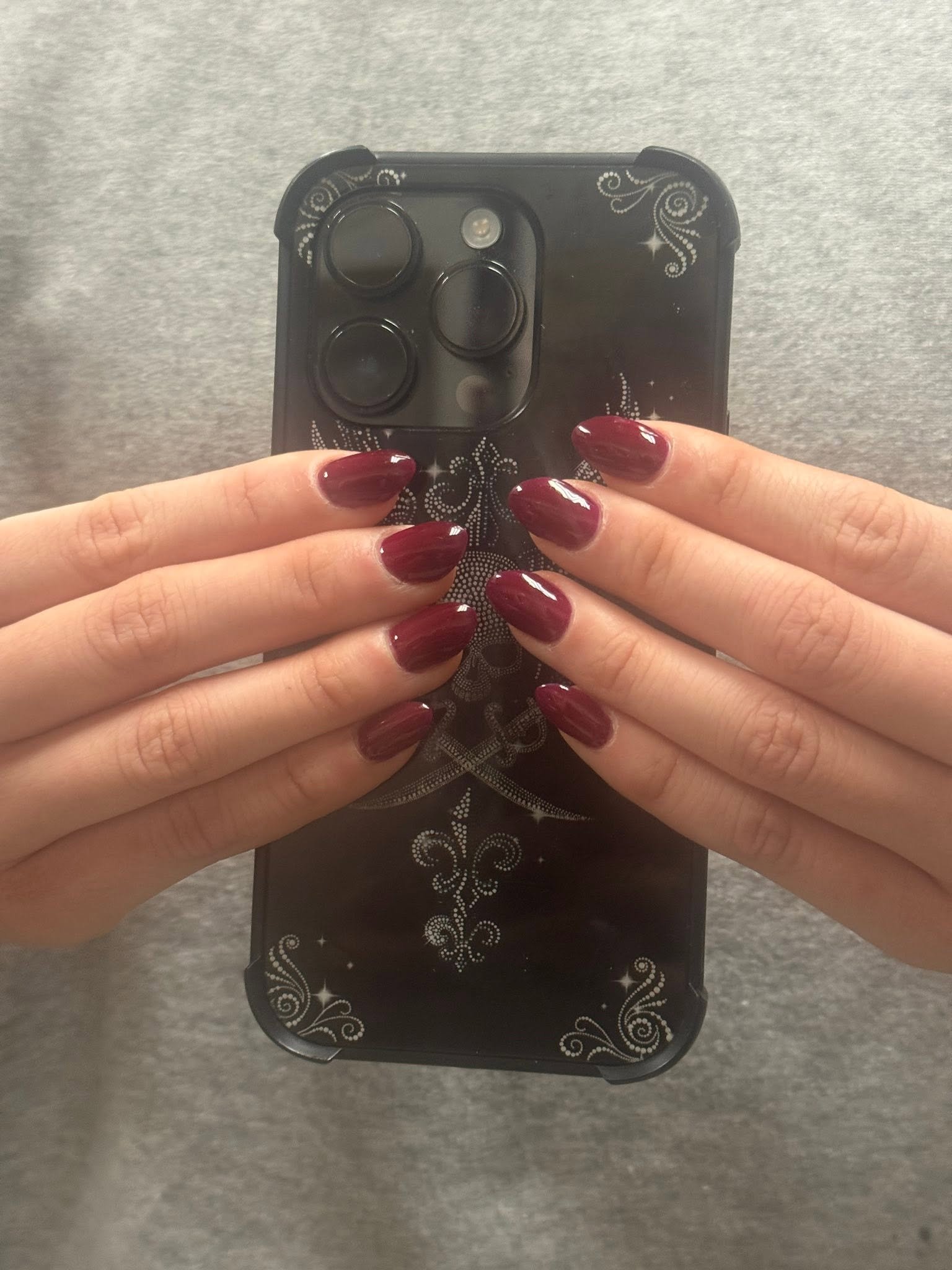 Burgundy glossy gel manicure