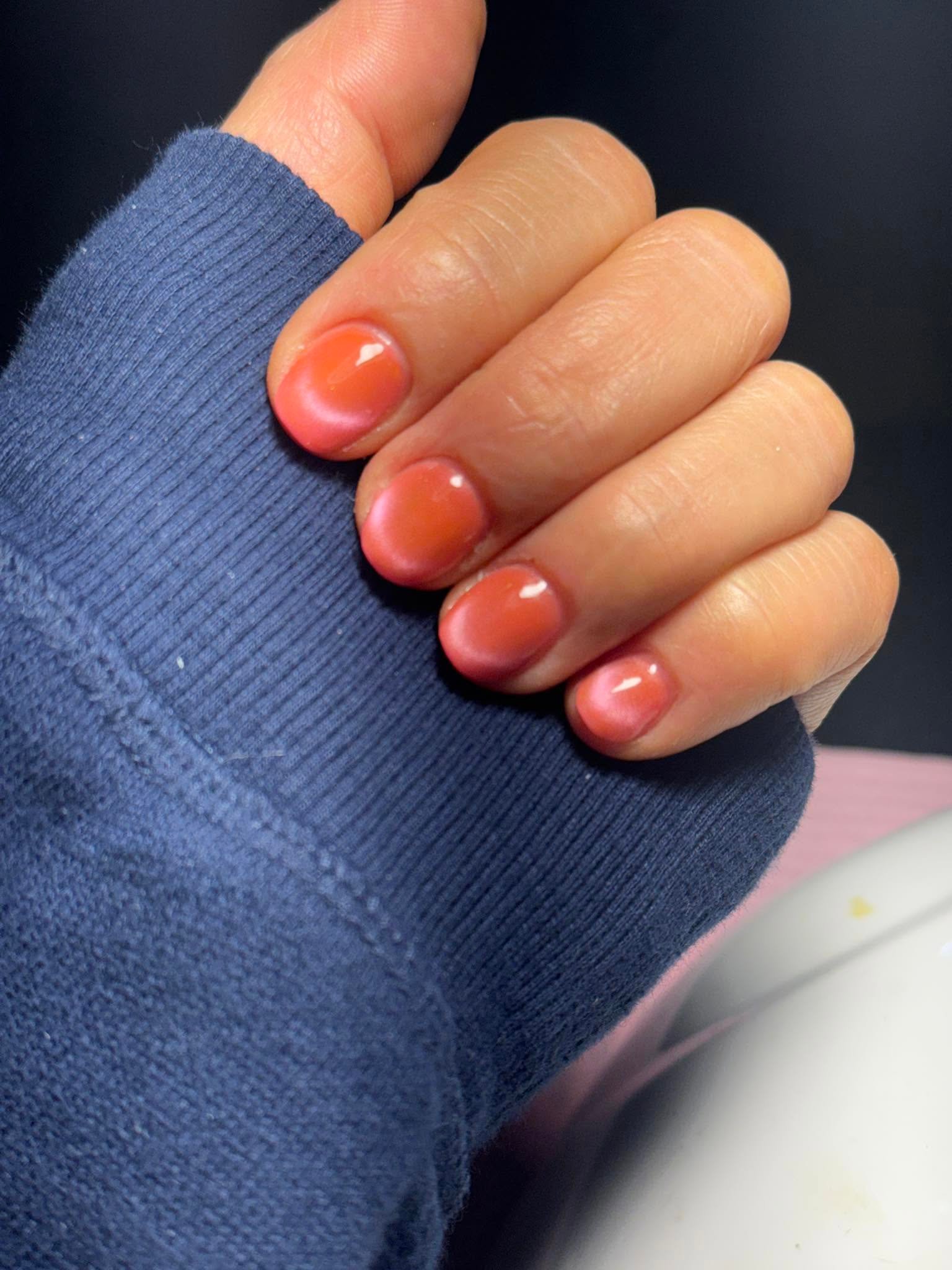 Sheer rust orange glossy nails