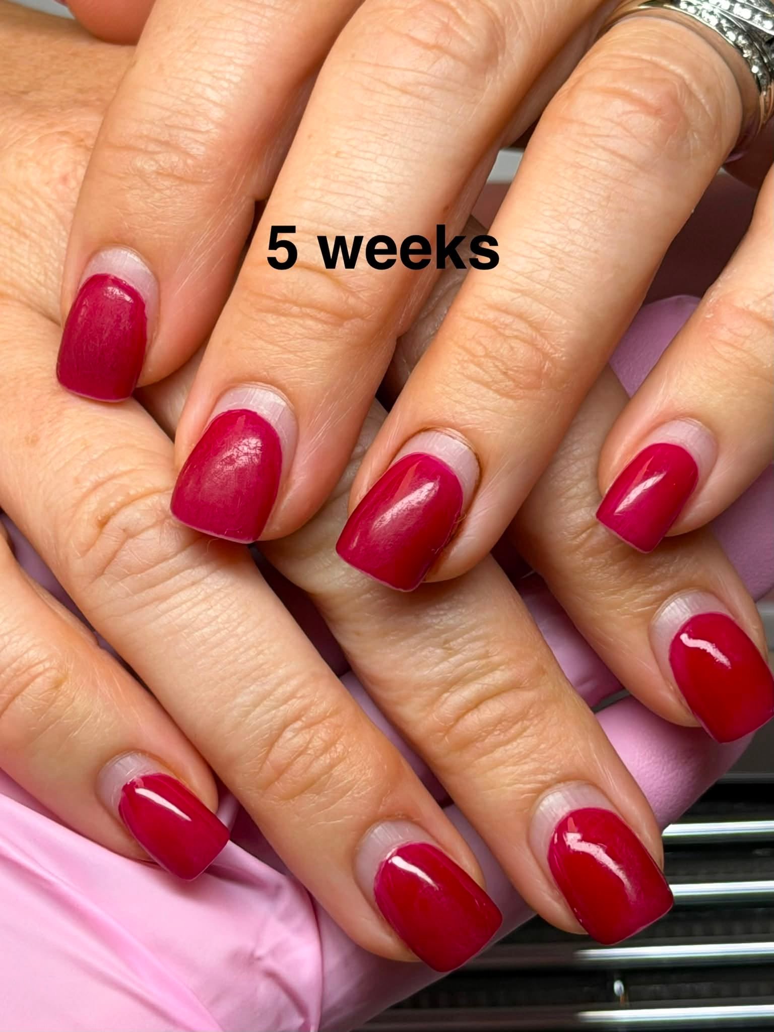 Deep red glossy gel manicure