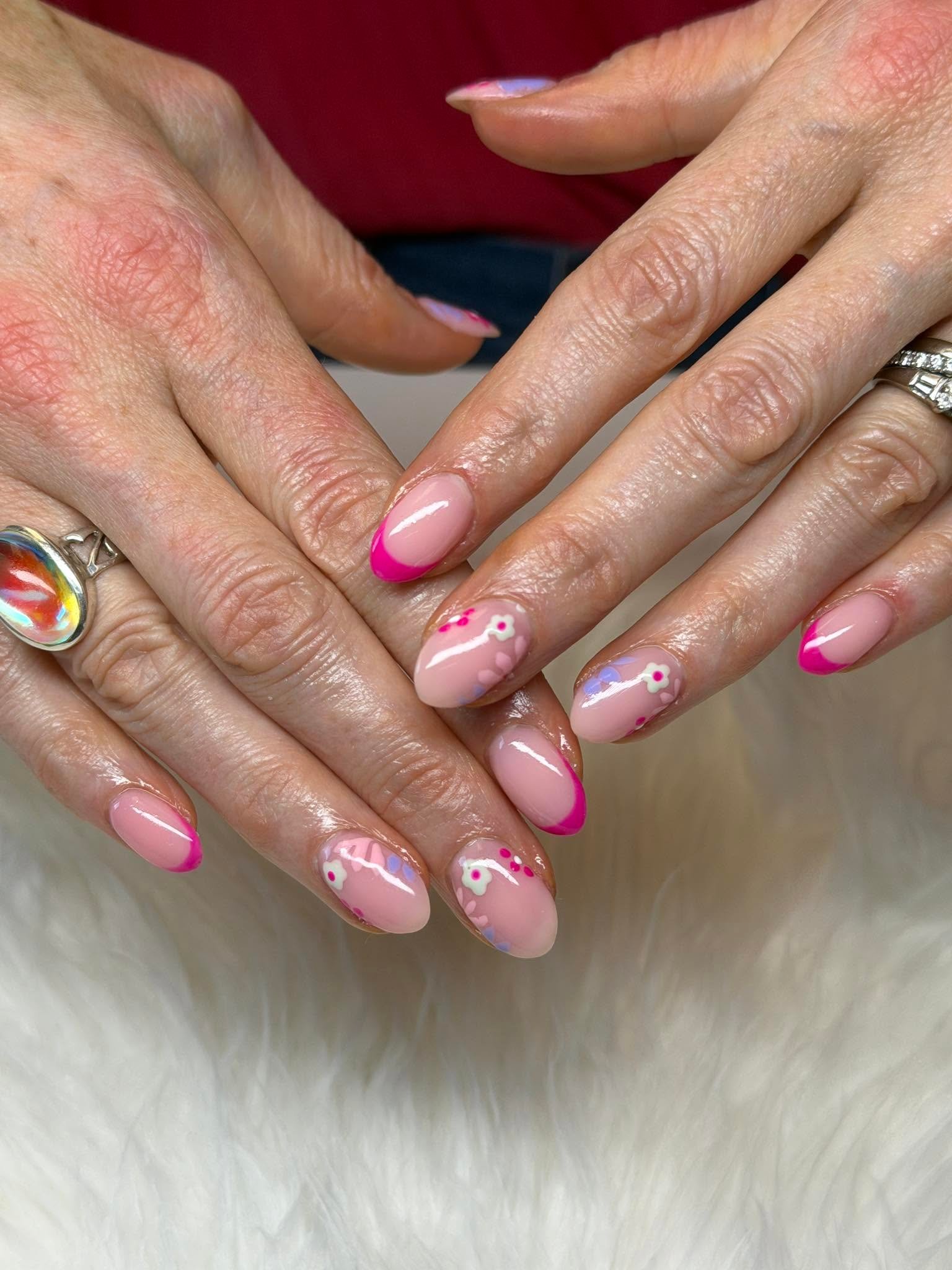 Red nails with a lavender and gold swirl accent nail