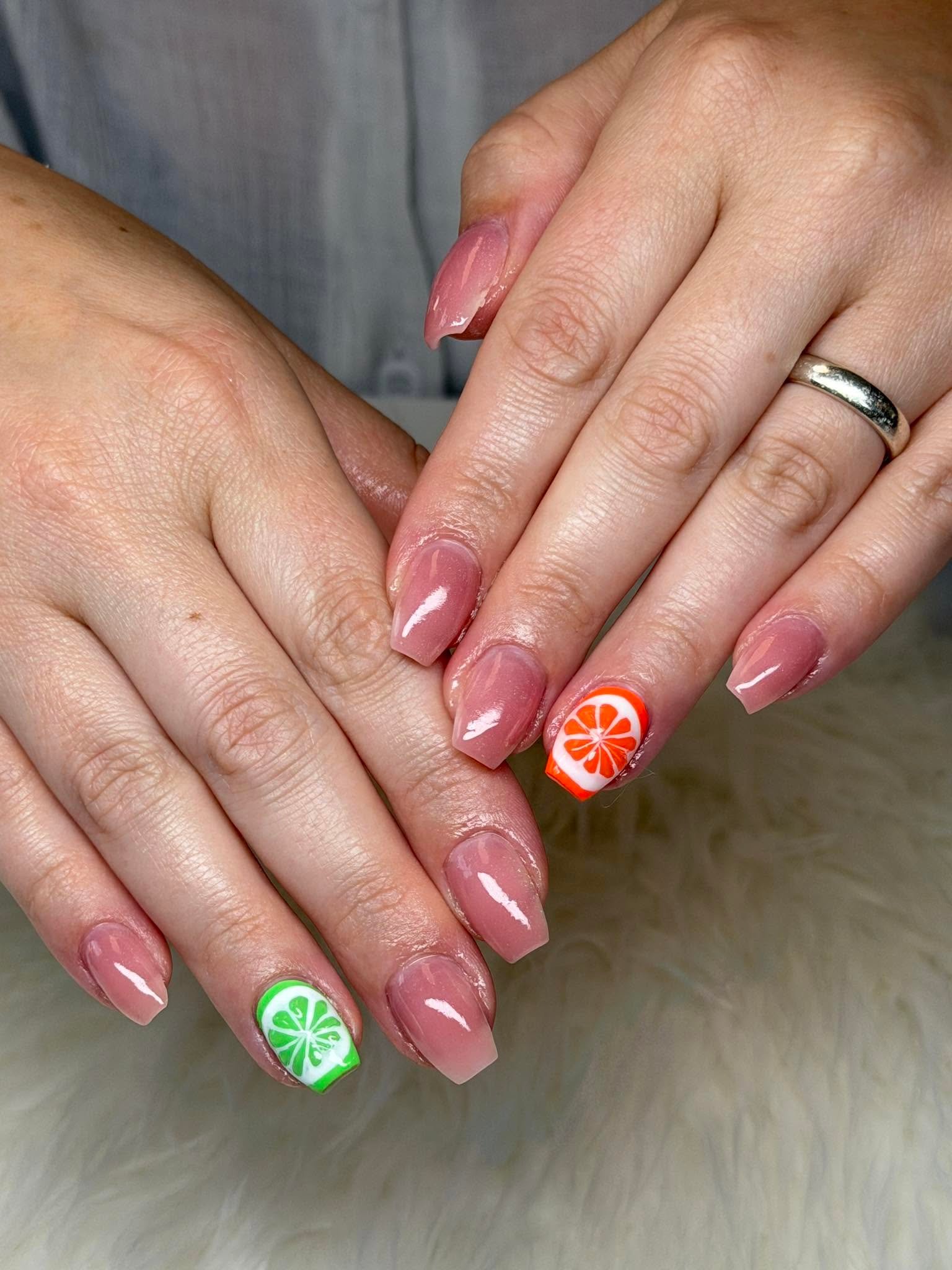 Nude nails with citrus fruit slice accent nails