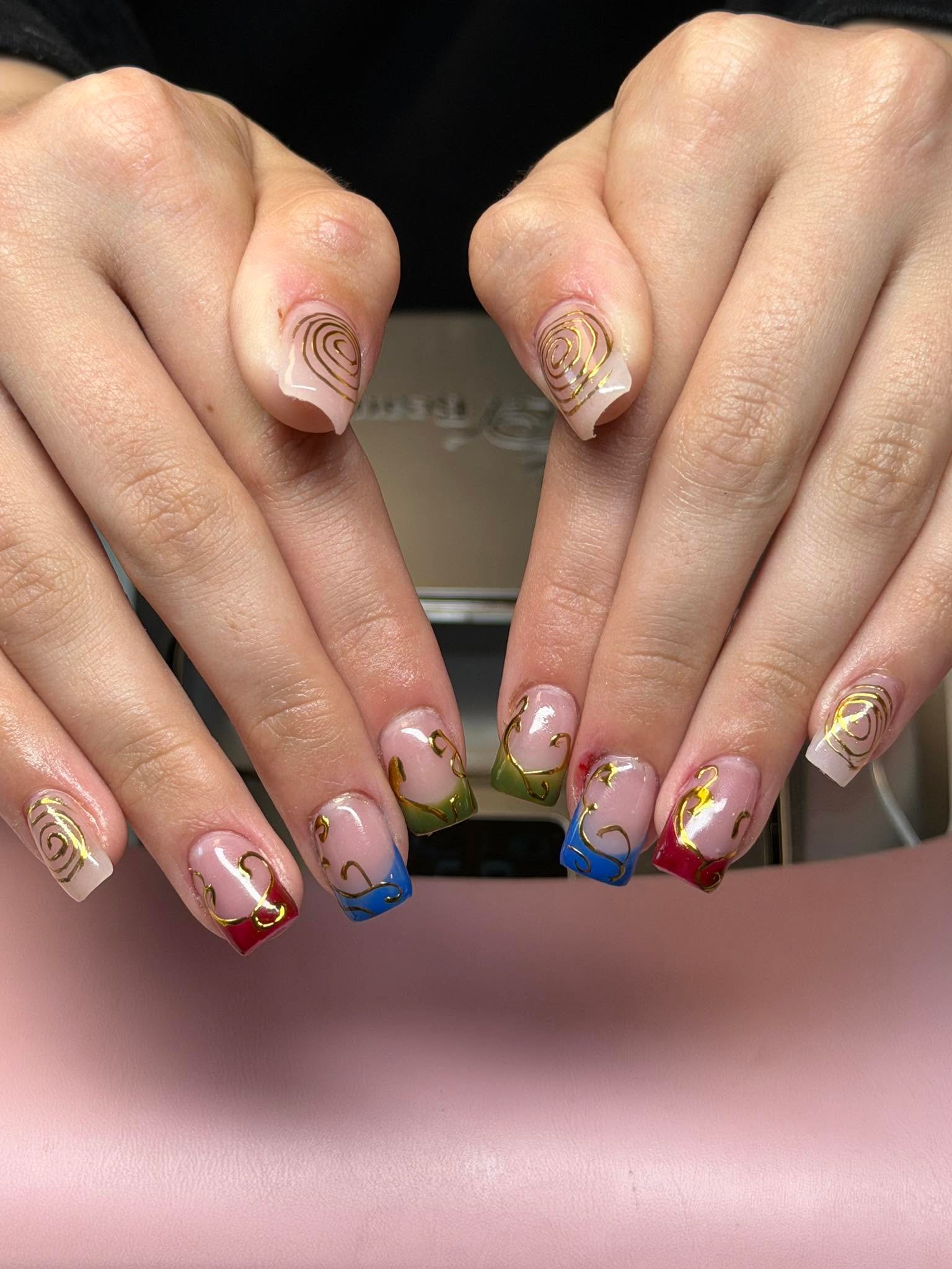 Nude nails with gold swirl art and colorful French tips