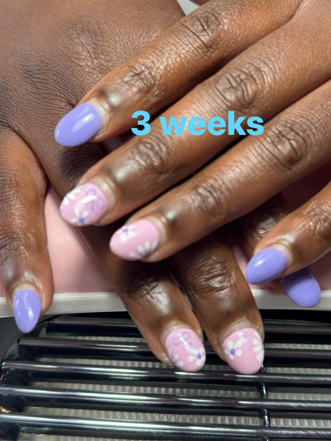 Lilac gel nails with pink floral accent nail design