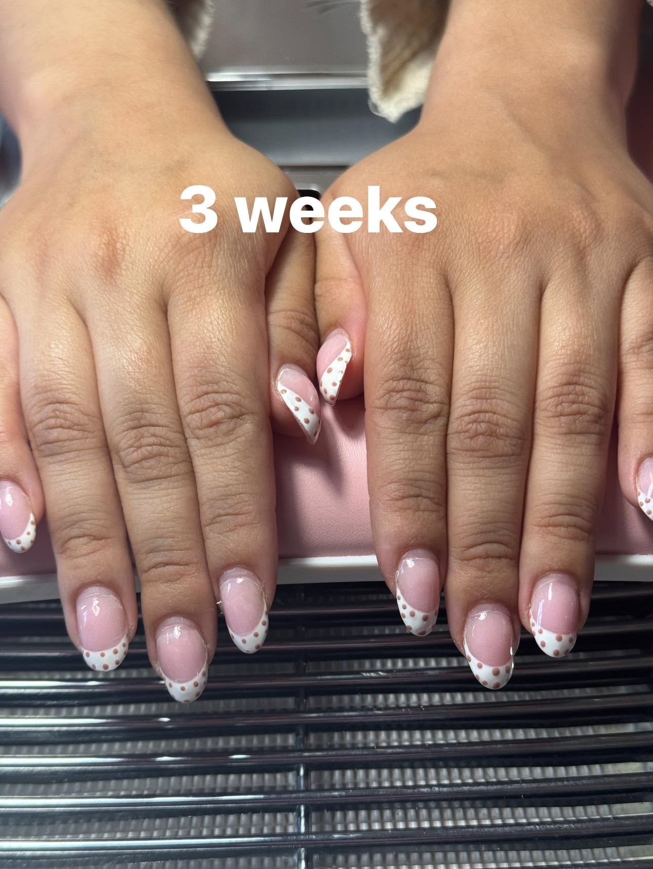 White French tips with tan polka dot pattern