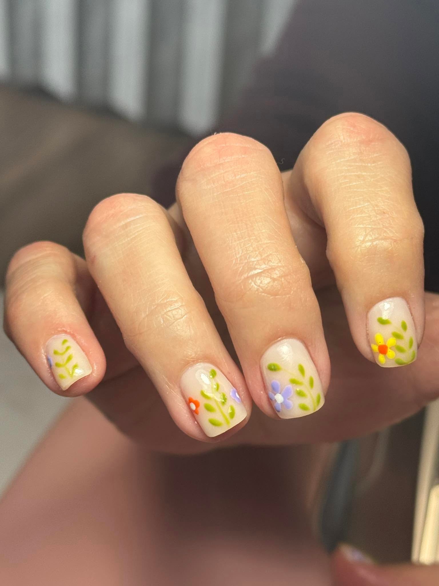 Nude nails with delicate hand-painted wildflower vine art