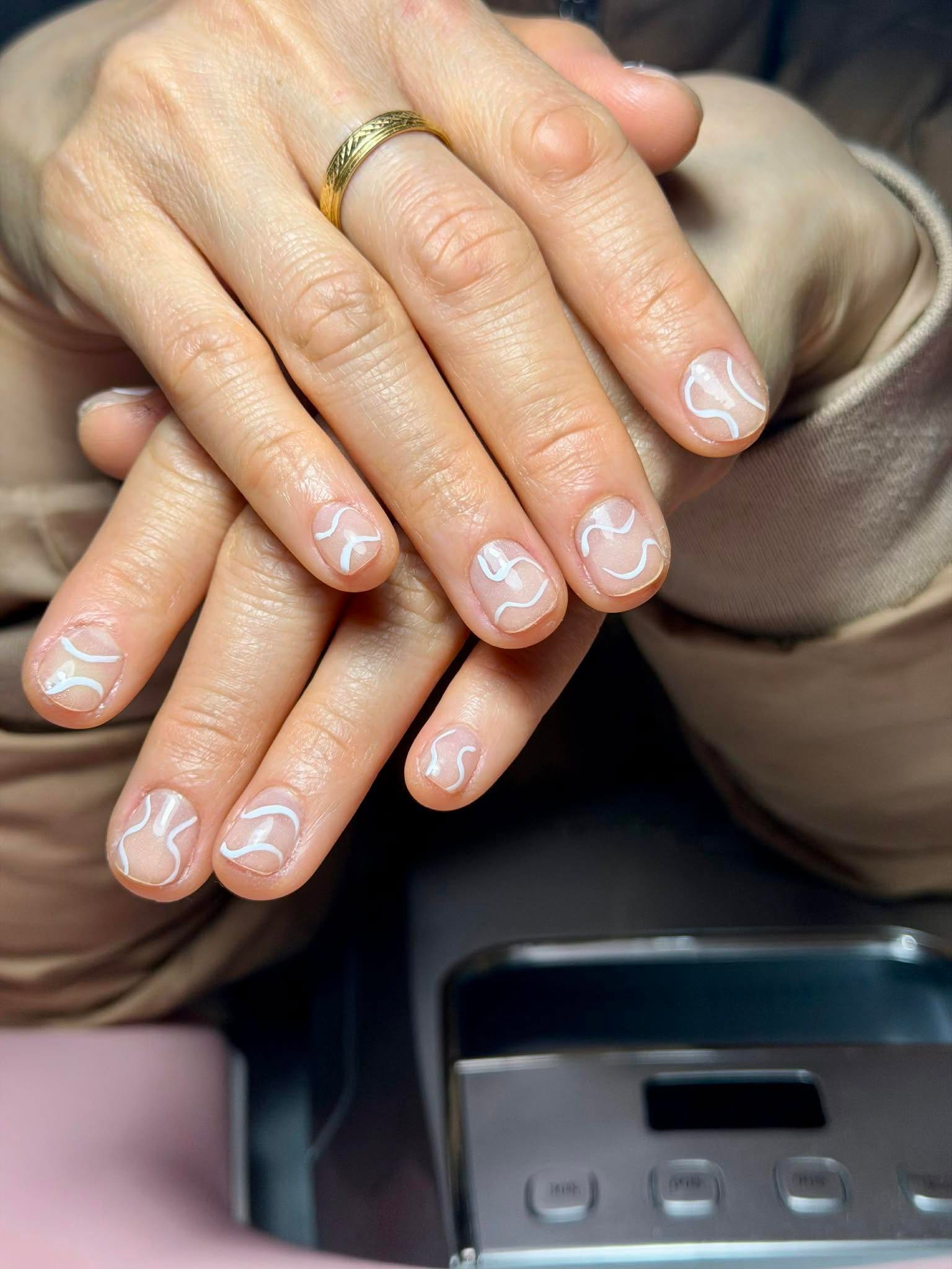 Nude nails with fine white swirl line art