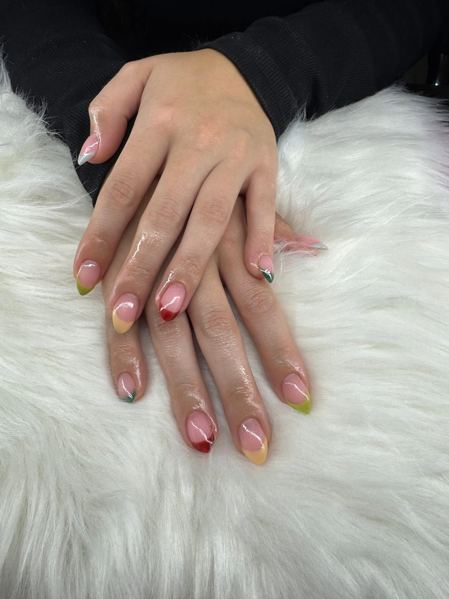 Multicolor negative-space French tips, matching hand
