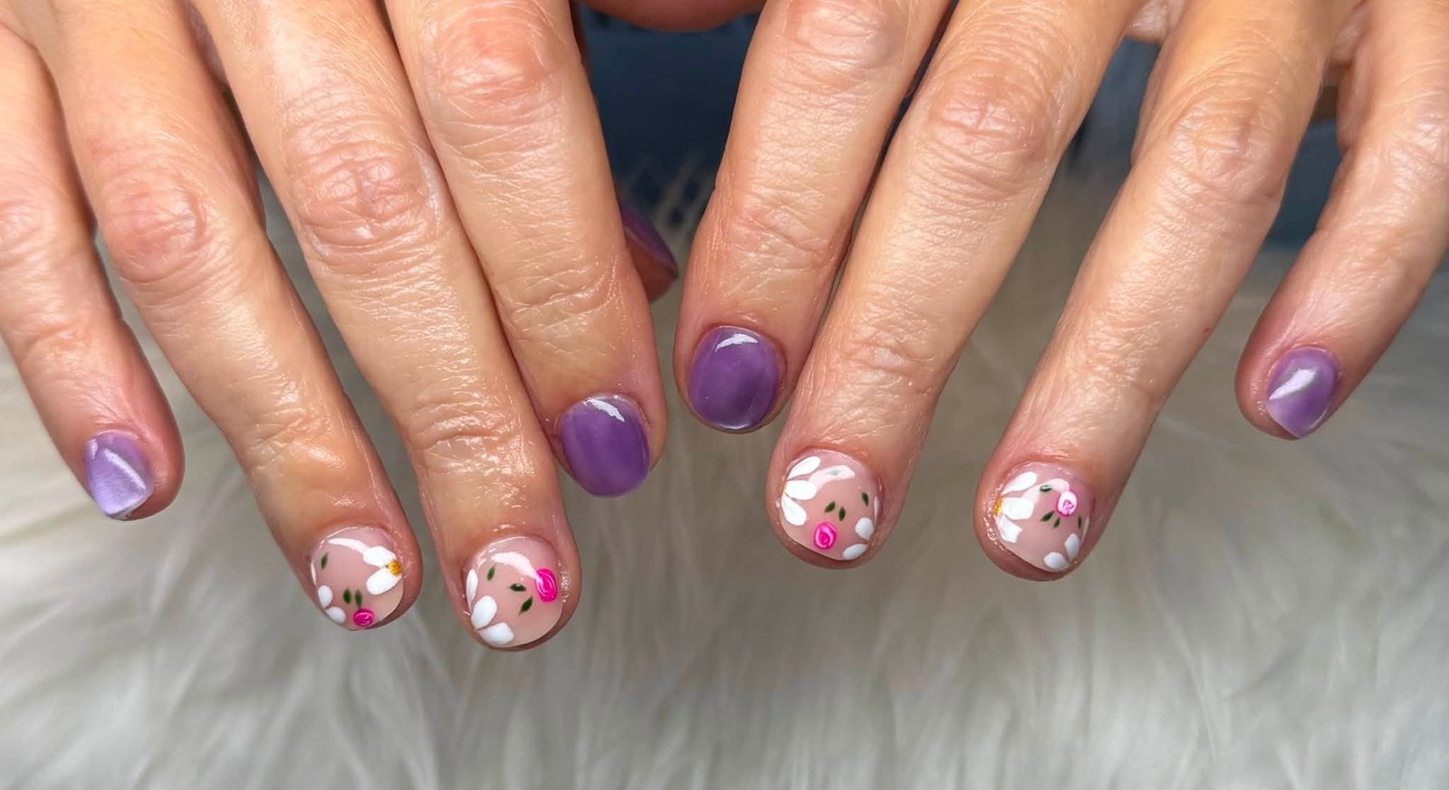 Lavender purple manicure with painted daisies