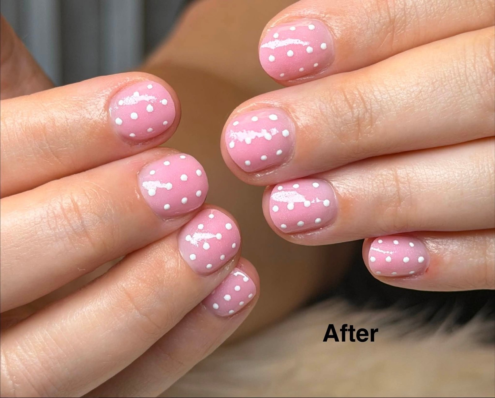 Pink manicure with white polka dot design