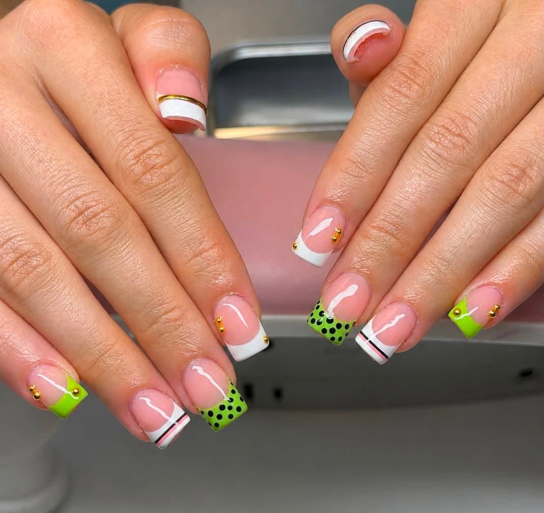 White French manicure with neon green and black dot art