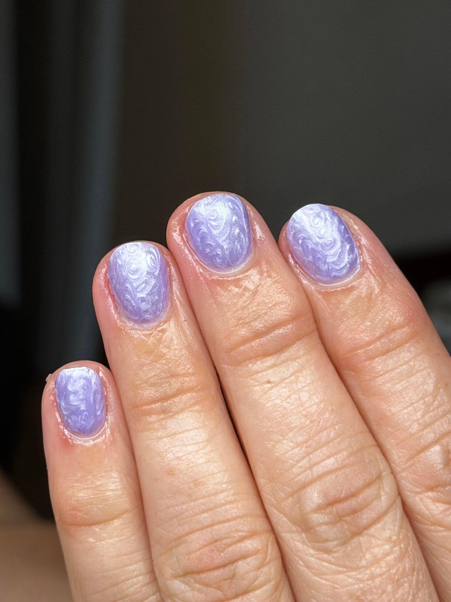 Lilac marble swirl nail design