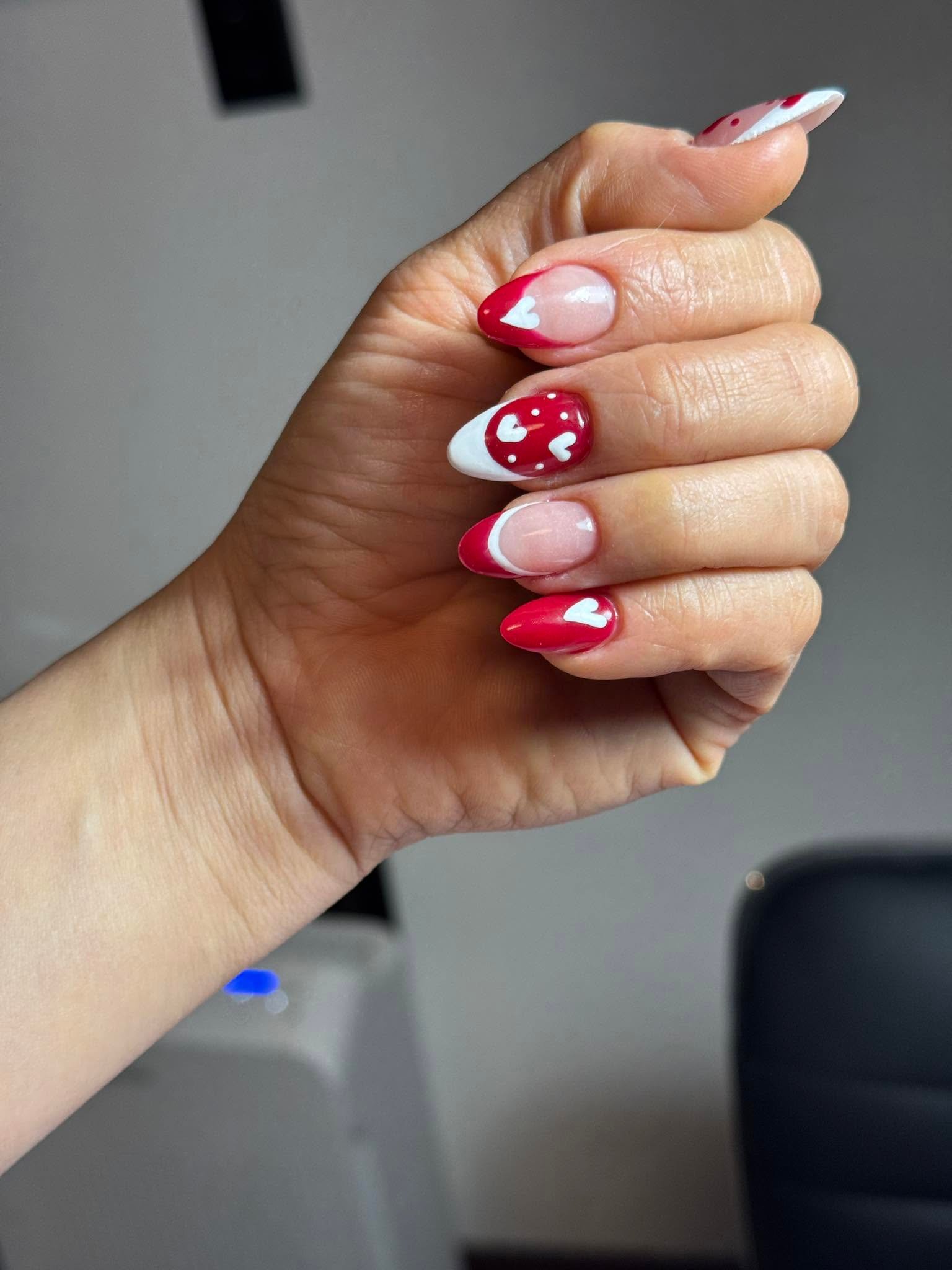 Red nails with white heart Valentine's Day design